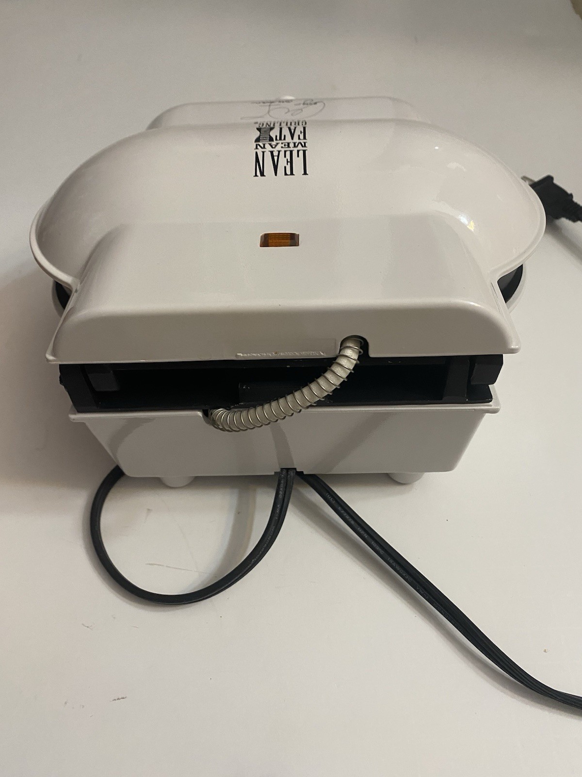 1999 GEORGE FOREMAN LEAN MEAN FAT REDUCING GRILLING MACHINE, MODEL GR10-WHITE
