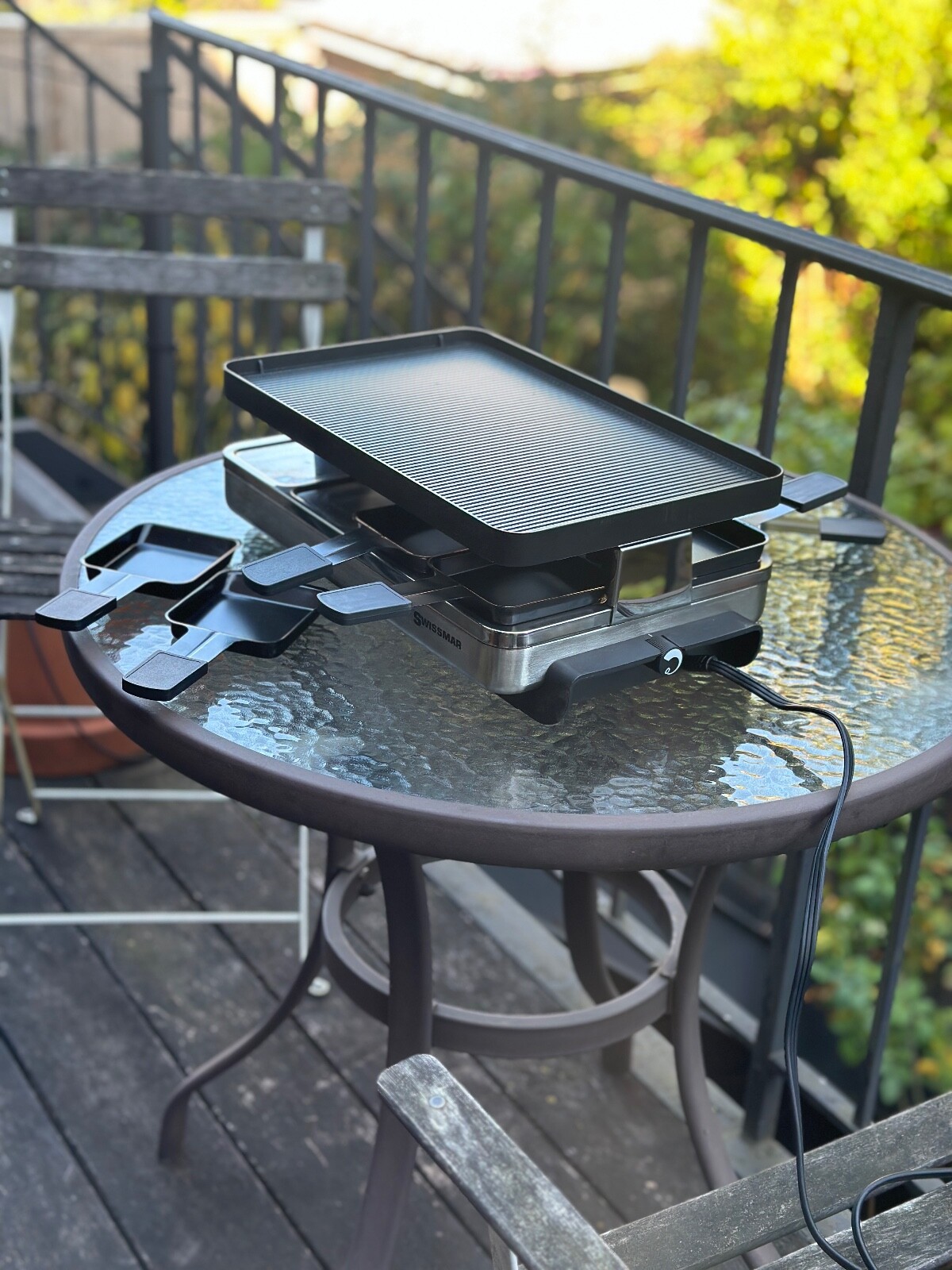 Swissmar 8-person raclette party grill with reversible cast aluminum.